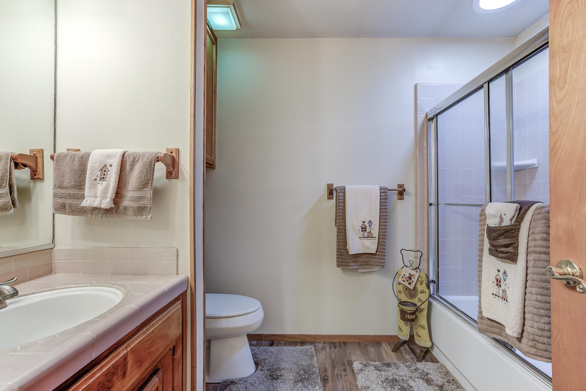 2730 Hall Road Corning, CA 96021 - Photo 21 of 52 a bathroom with a granite countertop toilet sink and mirror