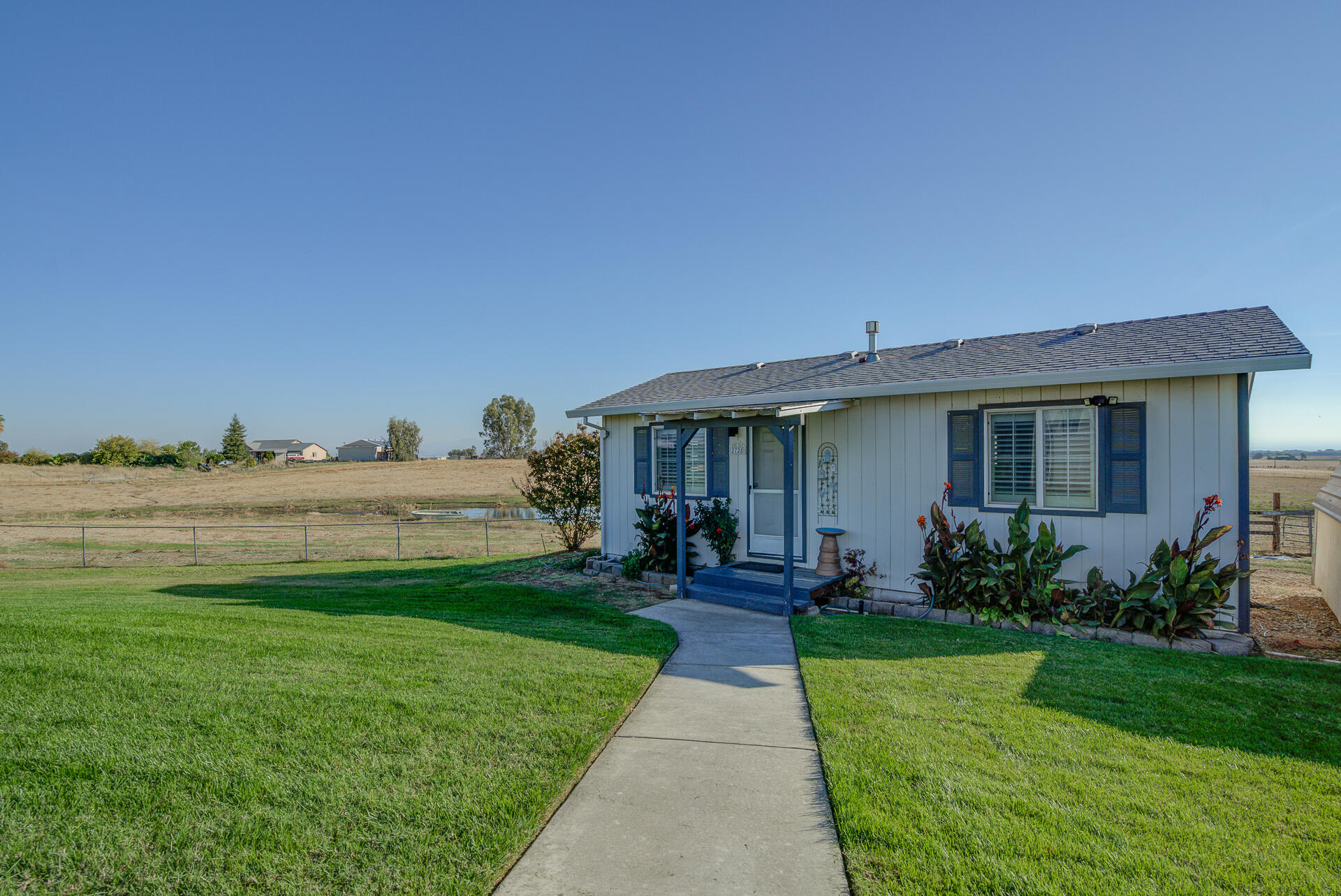 2730 Hall Road Corning, CA 96021 - Photo 24 of 52 a front view of a house with garden