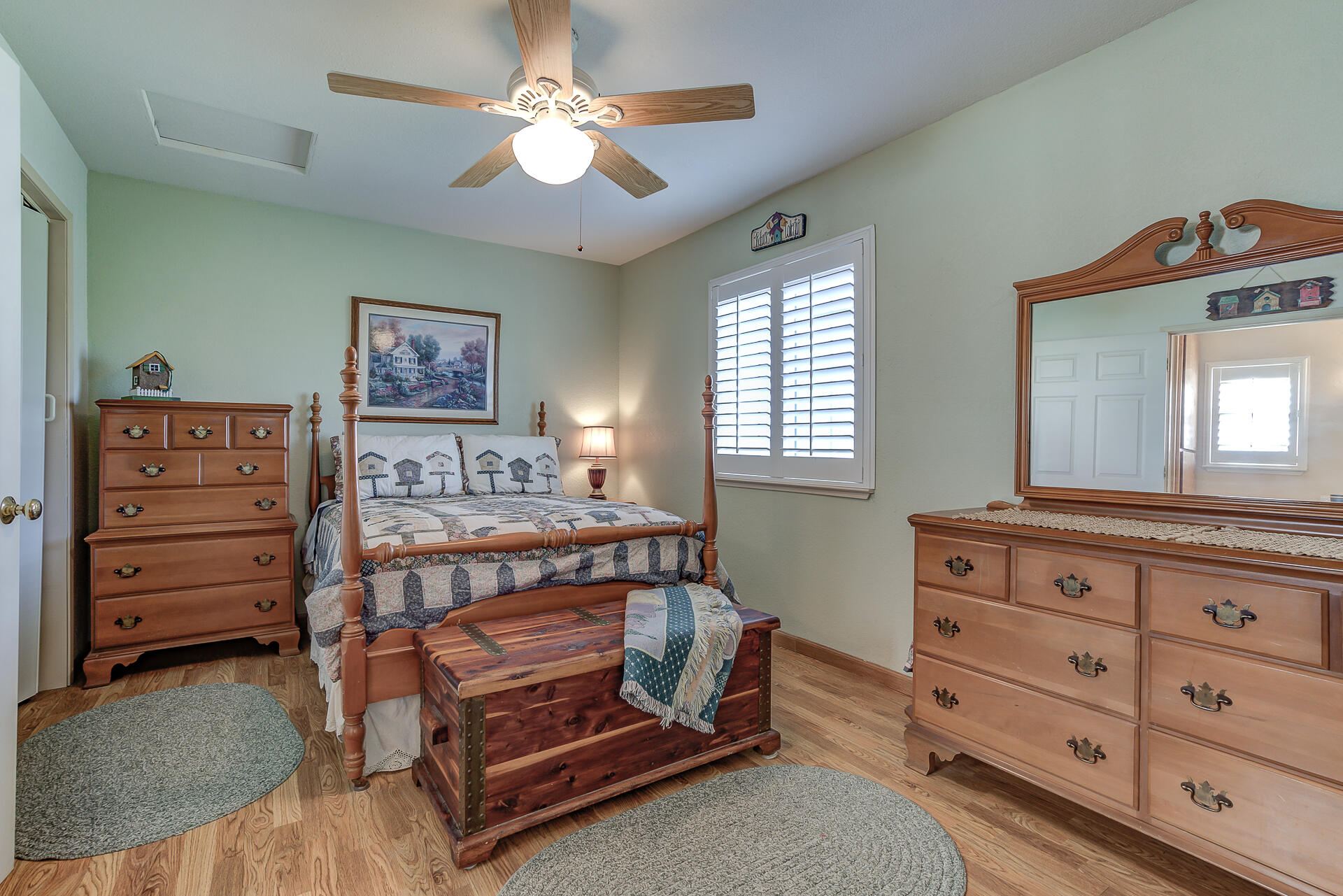 2730 Hall Road Corning, CA 96021 - Photo 30 of 52 a bedroom with a bed and a dresser in it