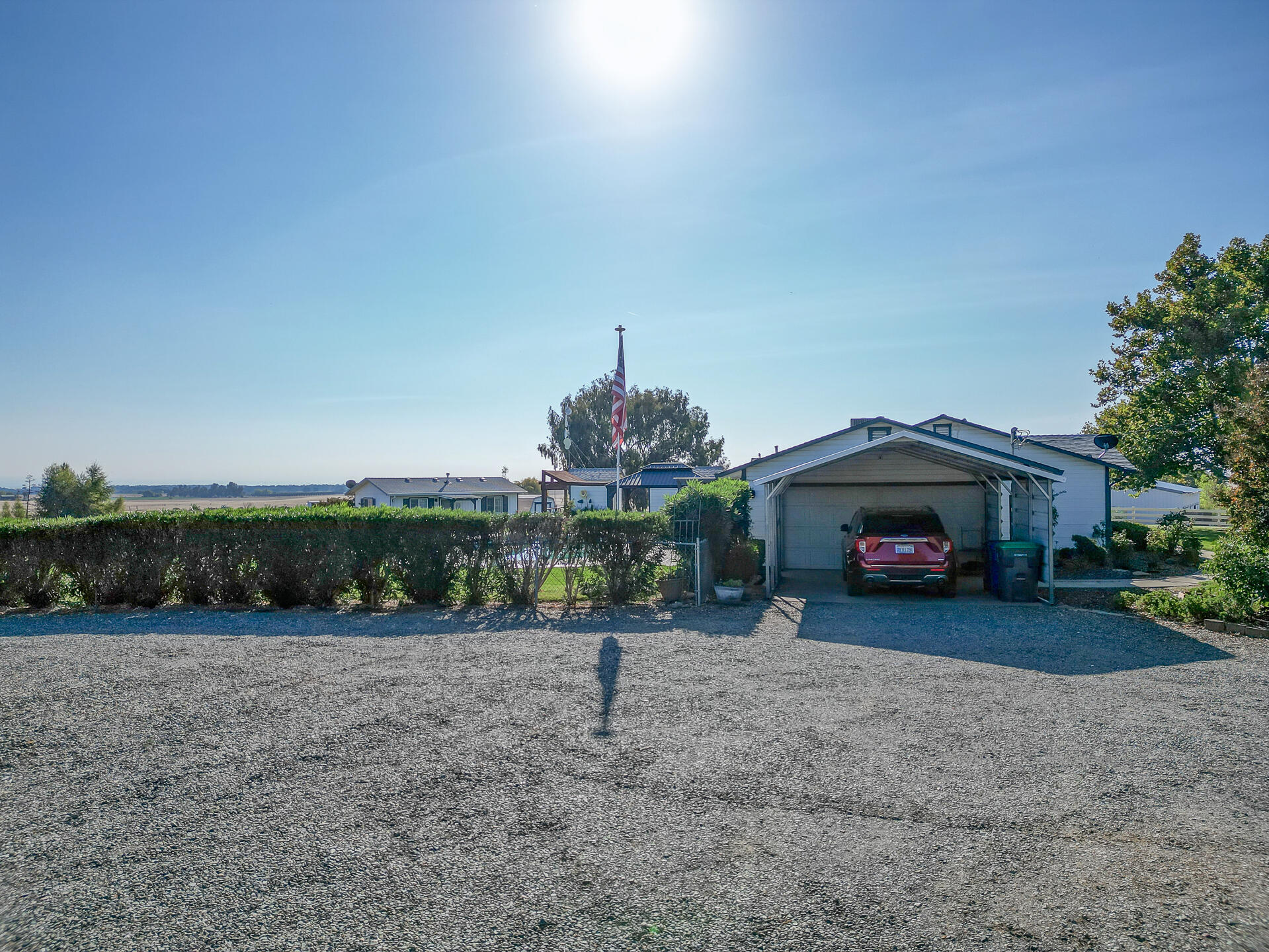 2730 Hall Road Corning, CA 96021 - Photo 42 of 52 a front view of a house with a yard and garage