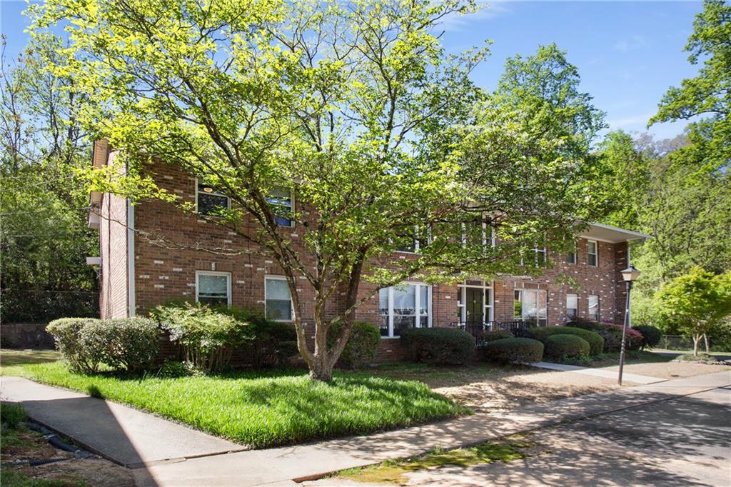 510 Coventry Road, Unit 11C Decatur, GA 30030 - Photo 1 of 1 a front view of a house with a garden