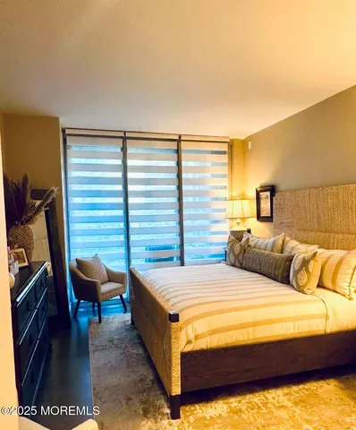 a living room with furniture and painting on the wall