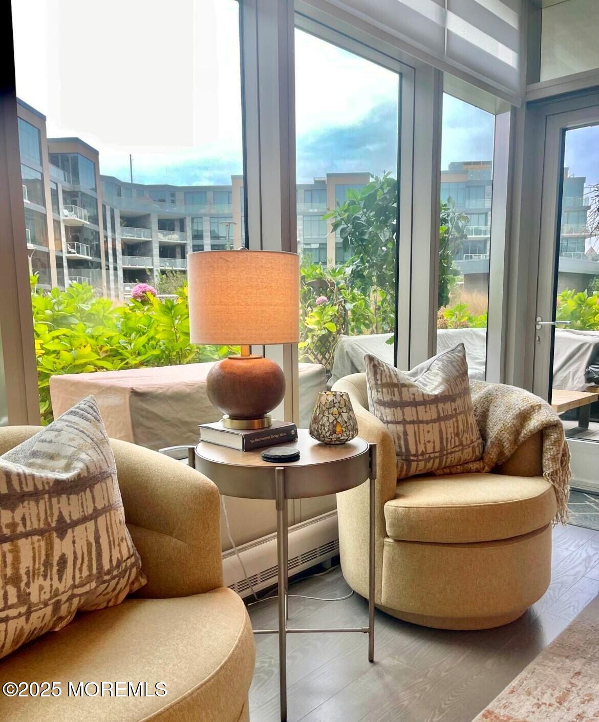 15 Morris Avenue, Unit 204 Long Branch, NJ 07740 - Photo 14 of 26 a living room with furniture and a large window
