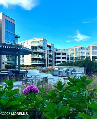 a view of roof deck with outdoor seating and wooden floor