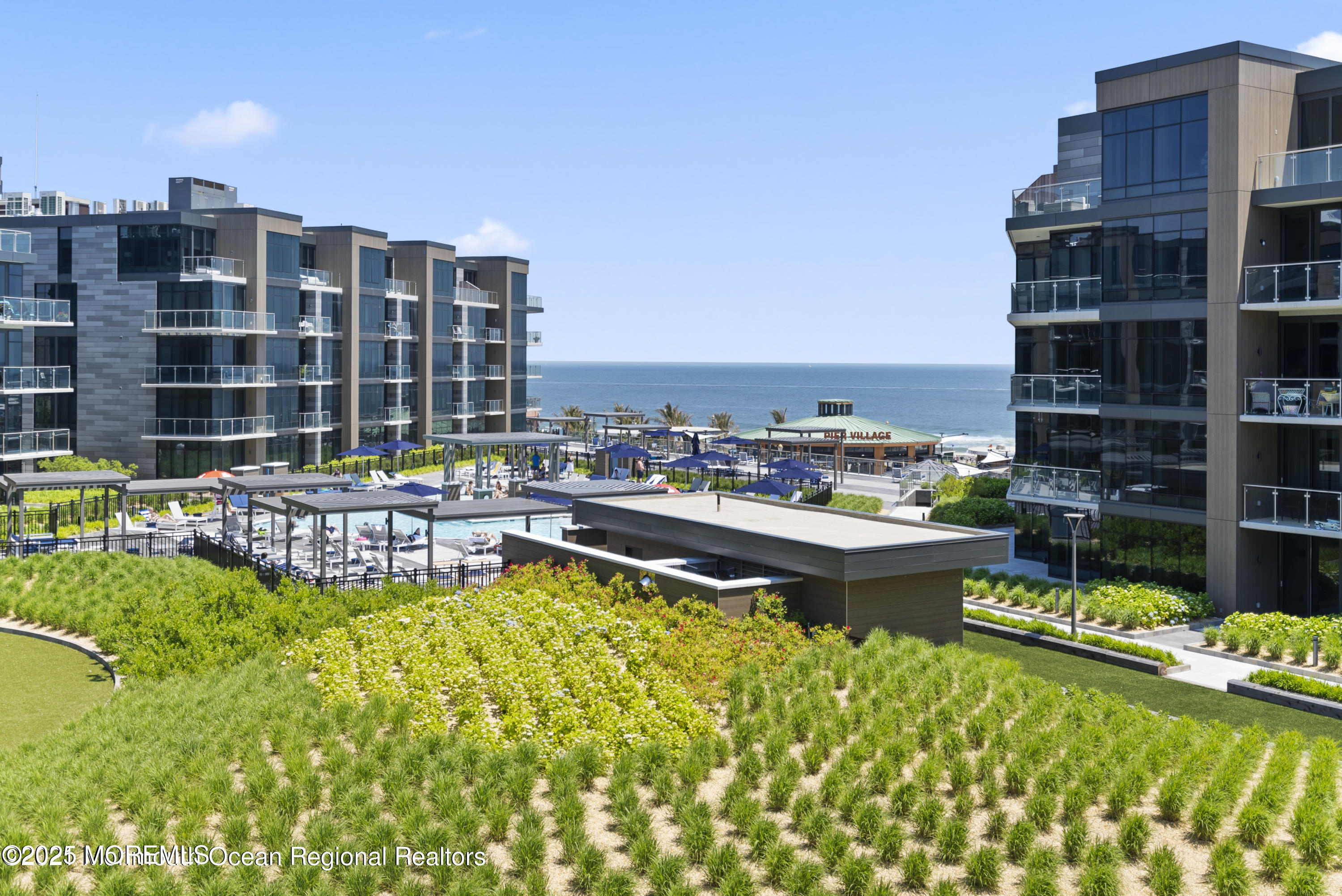 15 Morris Avenue, Unit 204 Long Branch, NJ 07740 - Photo 21 of 26 a view of swimming pool with outdoor seating and a garden