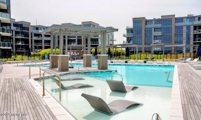 a view of a swimming pool with a patio
