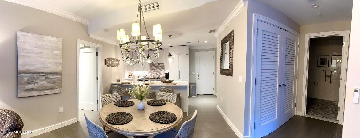 15 Morris Avenue, Unit 204 Long Branch, NJ 07740 - Photo 7 of 26 a view of dining room and cabinets with wooden floor