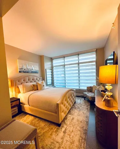 a bedroom with a bed and a chair