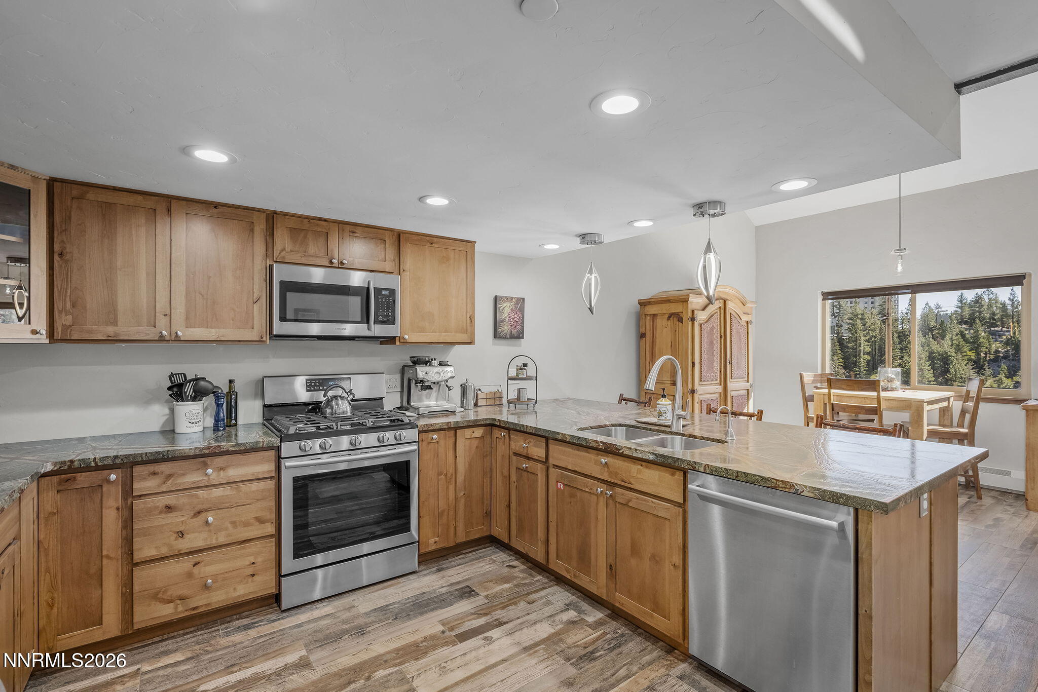 396 Tramway Drive Stateline, NV 89449 - Photo 5 of 19 a kitchen with sink a microwave and cabinets
