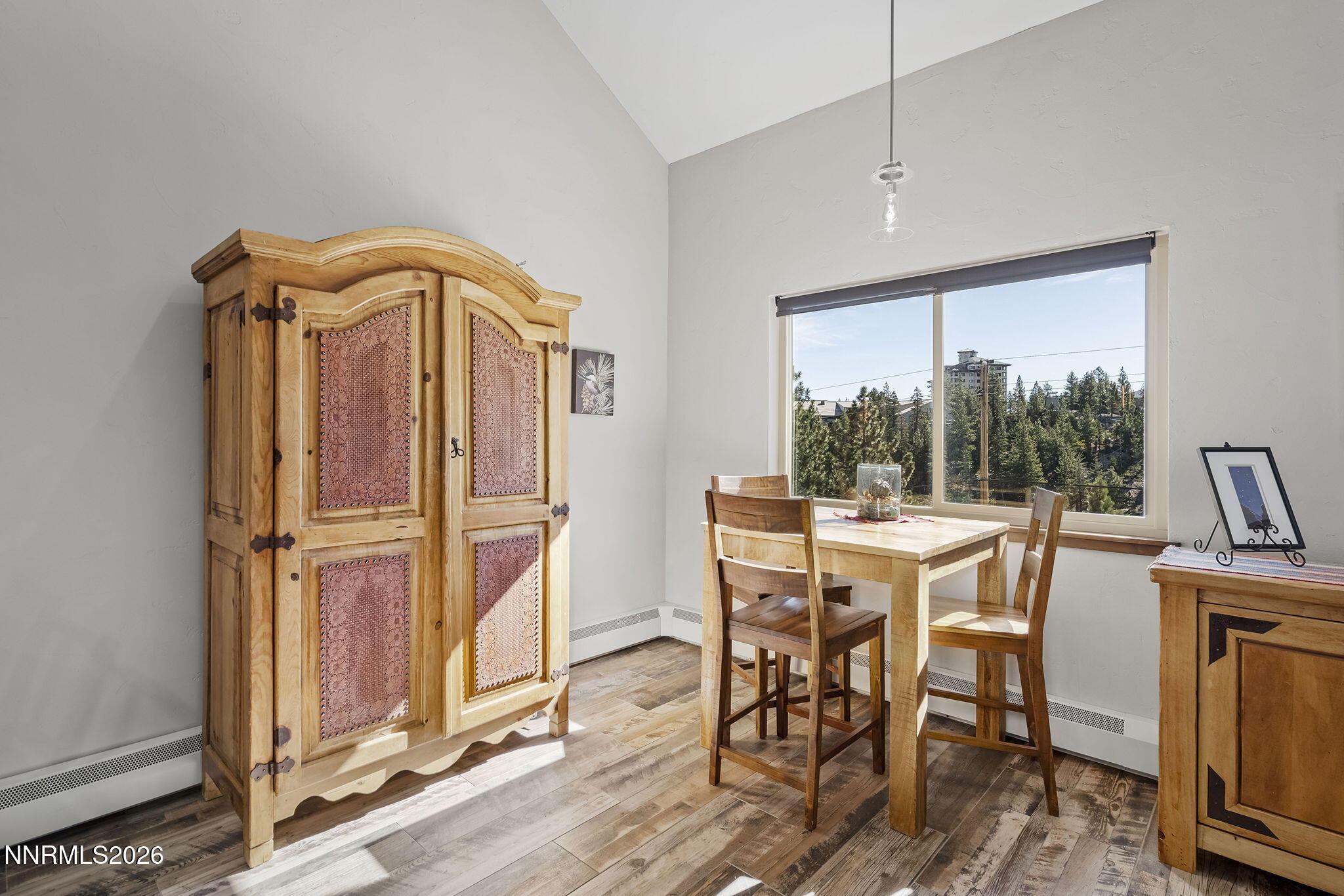 396 Tramway Drive Stateline, NV 89449 - Photo 7 of 19 a dining room with furniture window wooden floor and a rug