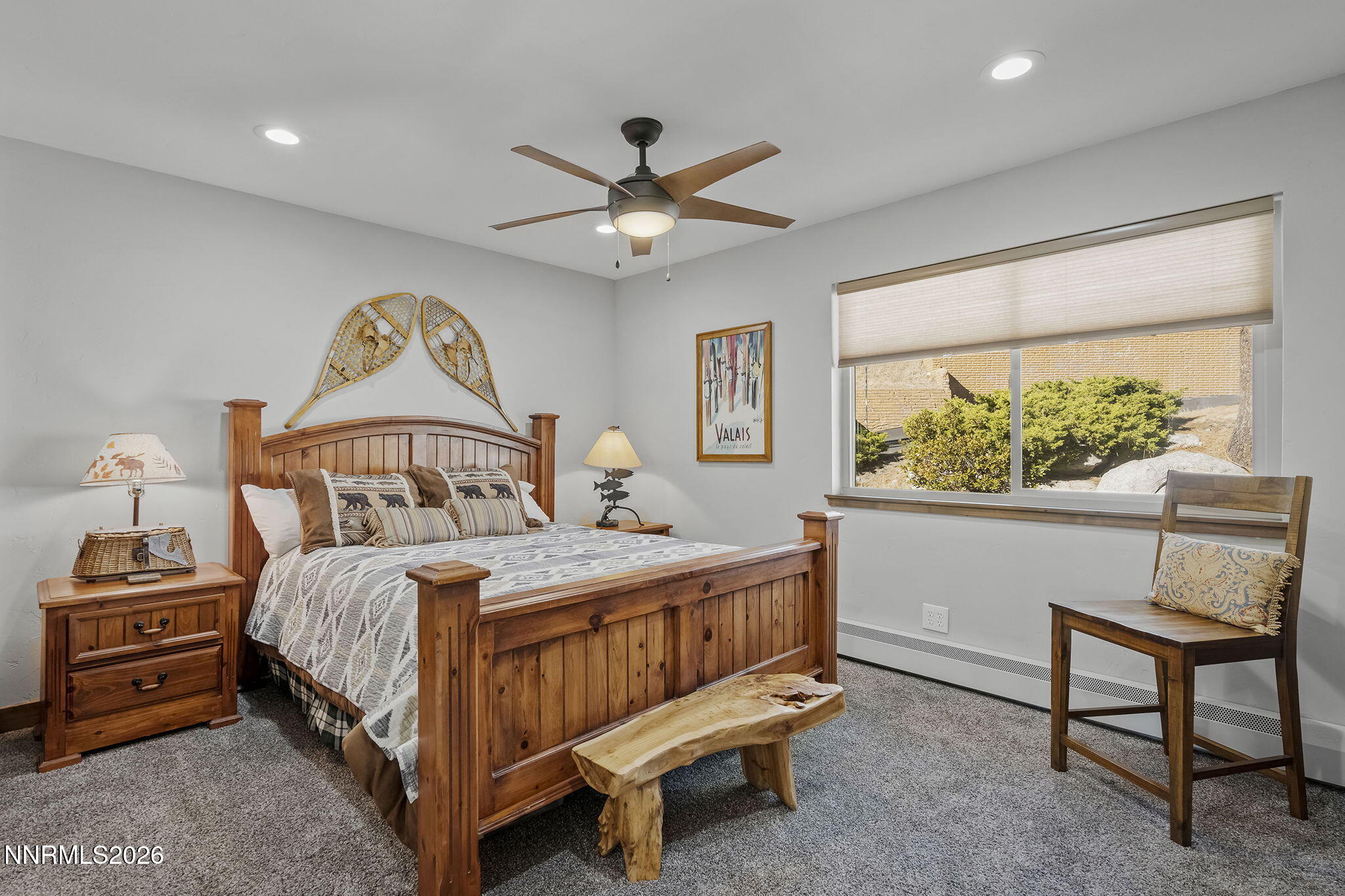 396 Tramway Drive Stateline, NV 89449 - Photo 8 of 19 a bedroom with a bed a window and a chandelier