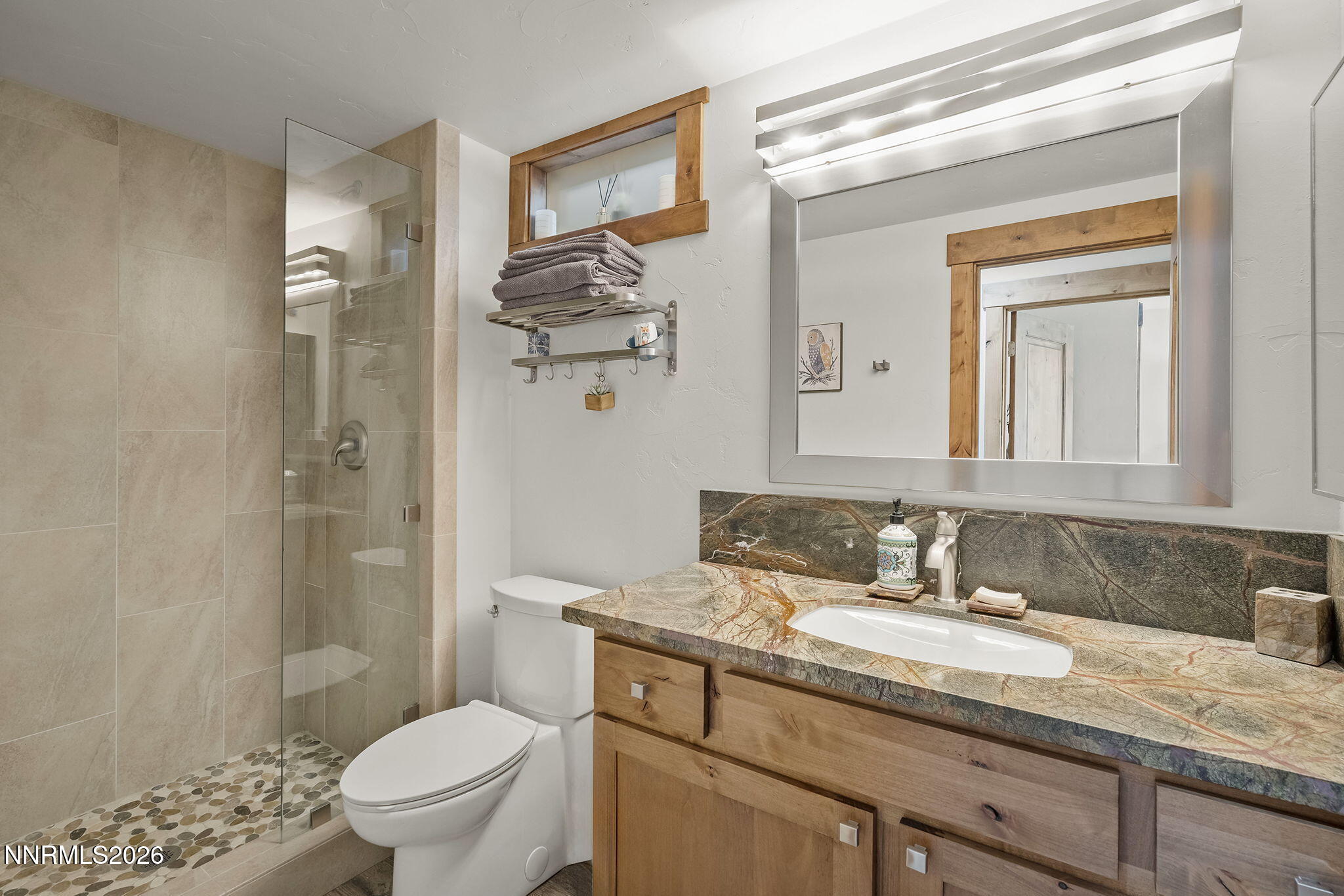 396 Tramway Drive Stateline, NV 89449 - Photo 10 of 19 a bathroom with a granite countertop sink toilet and shower