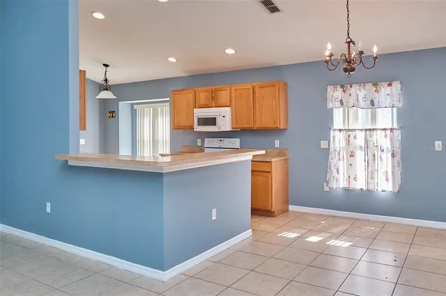 a kitchen with stainless steel appliances granite countertop a stove and a sink
