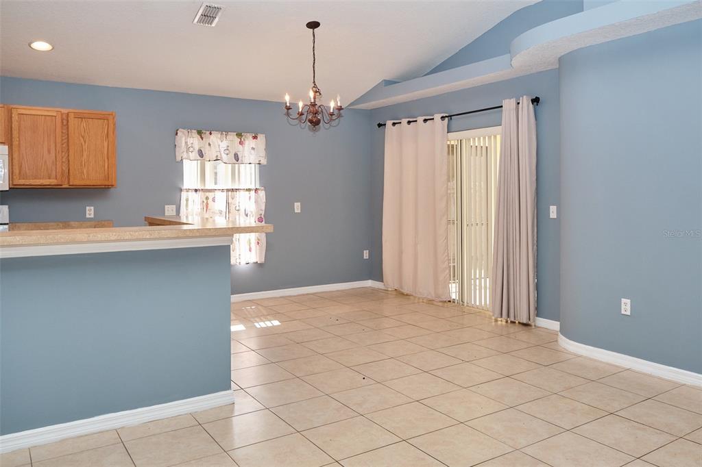 2726 Randal Way Kissimmee, FL 34743 - Photo 14 of 20 a view of a kitchen with a sink and windows