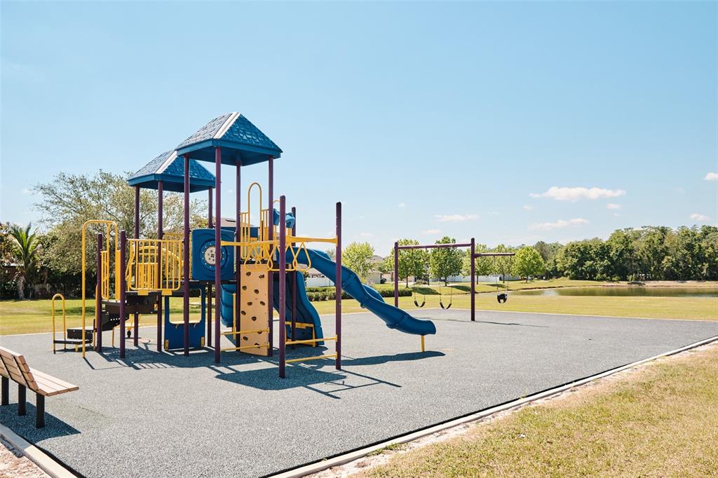 2726 Randal Way Kissimmee, FL 34743 - Photo 17 of 20 a view of a swimming pool with a bench and lawn chairs