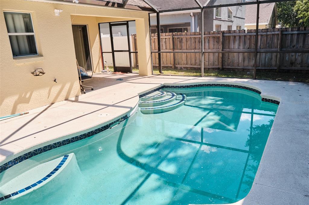 2726 Randal Way Kissimmee, FL 34743 - Photo 2 of 20 a swimming pool with a tub