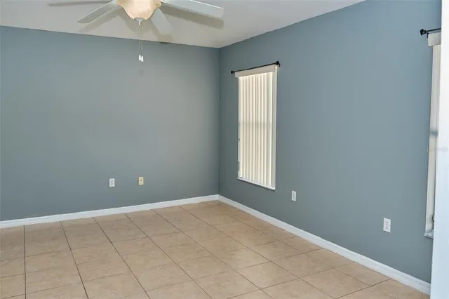 an empty room with a empty space and a window