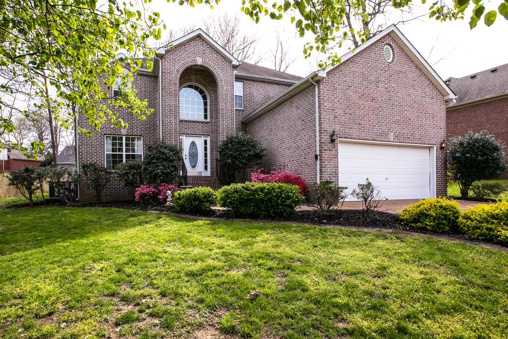 1609 Inverness Drive Spring Hill, TN 37174 - Photo 2 of 30 The wooded lot immediately gives you a serene "I'm home" feeling.