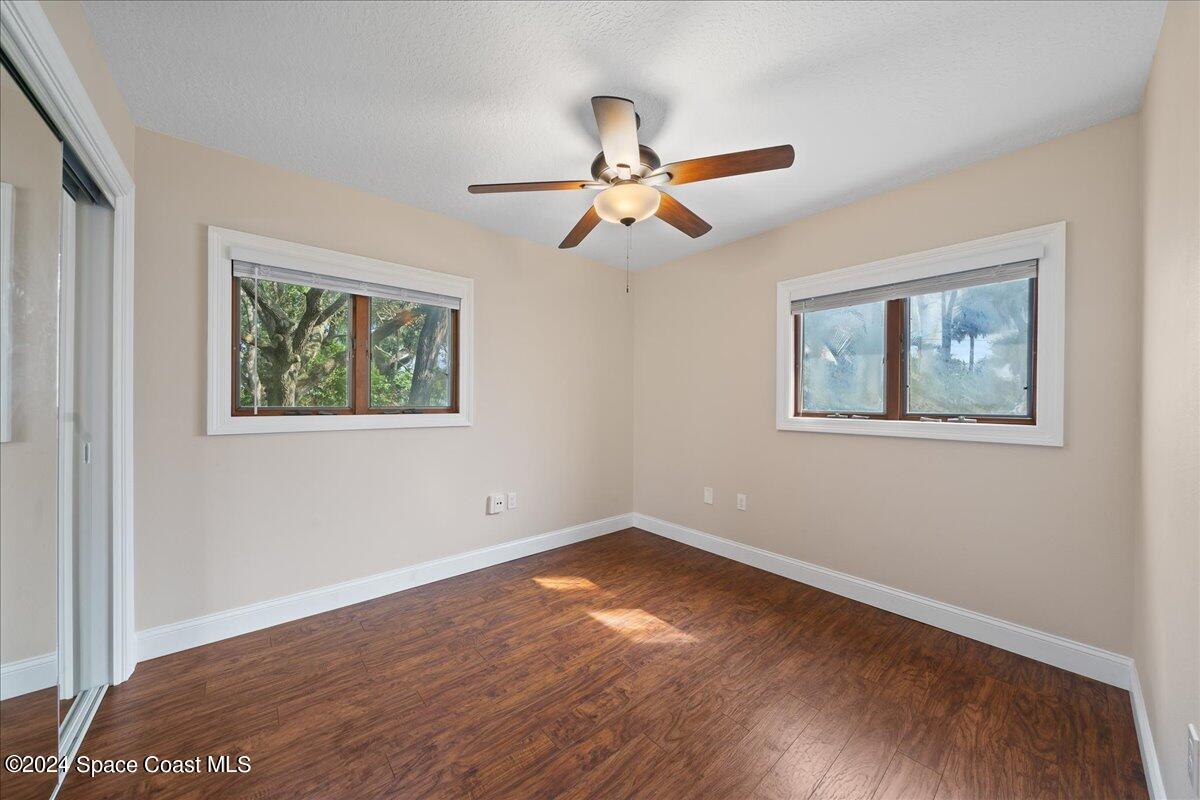 1469 Rockledge Drive Rockledge, FL 32955 - Photo 14 of 67 a view of empty room with wooden floor