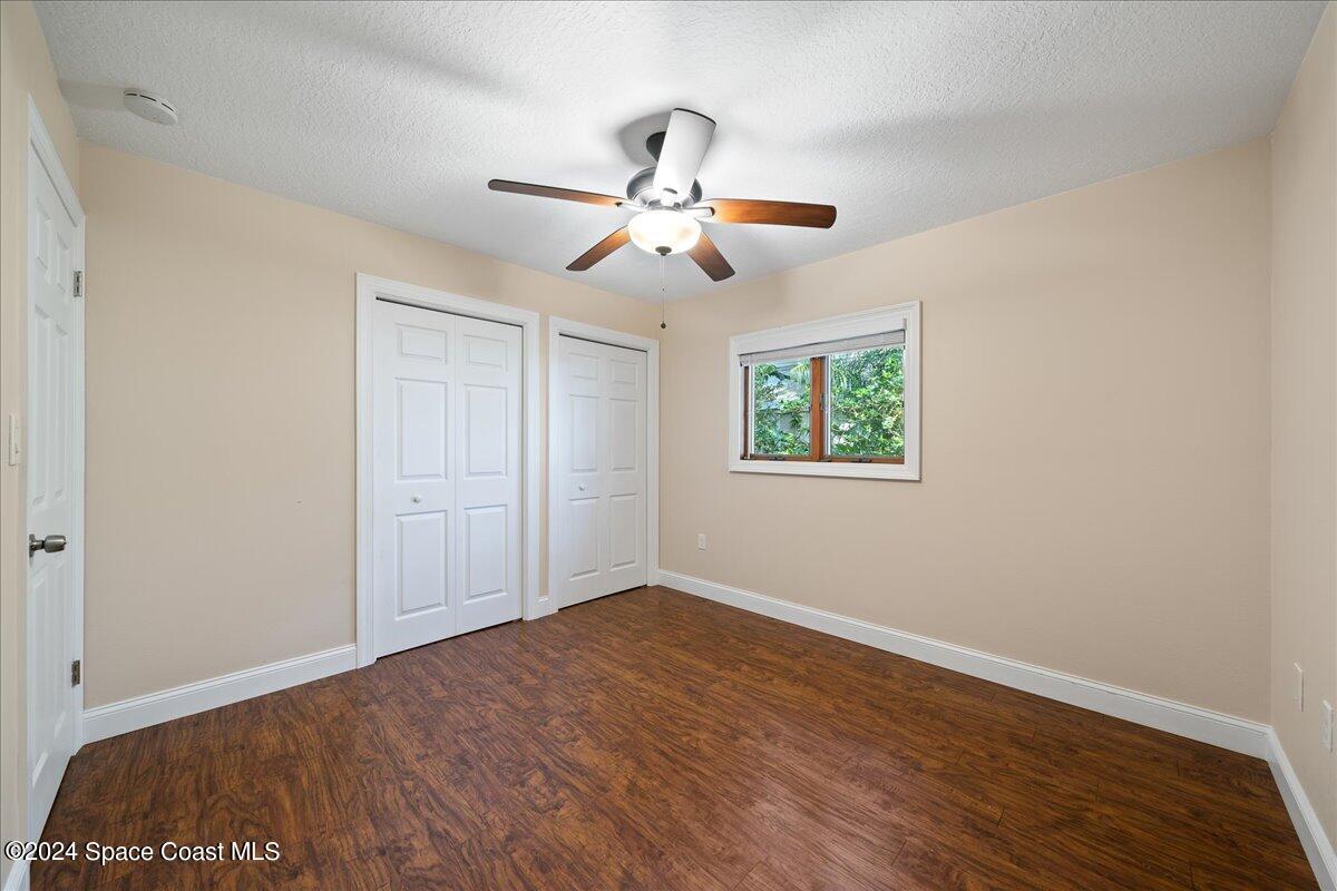 1469 Rockledge Drive Rockledge, FL 32955 - Photo 16 of 67 a view of empty room with wooden floor