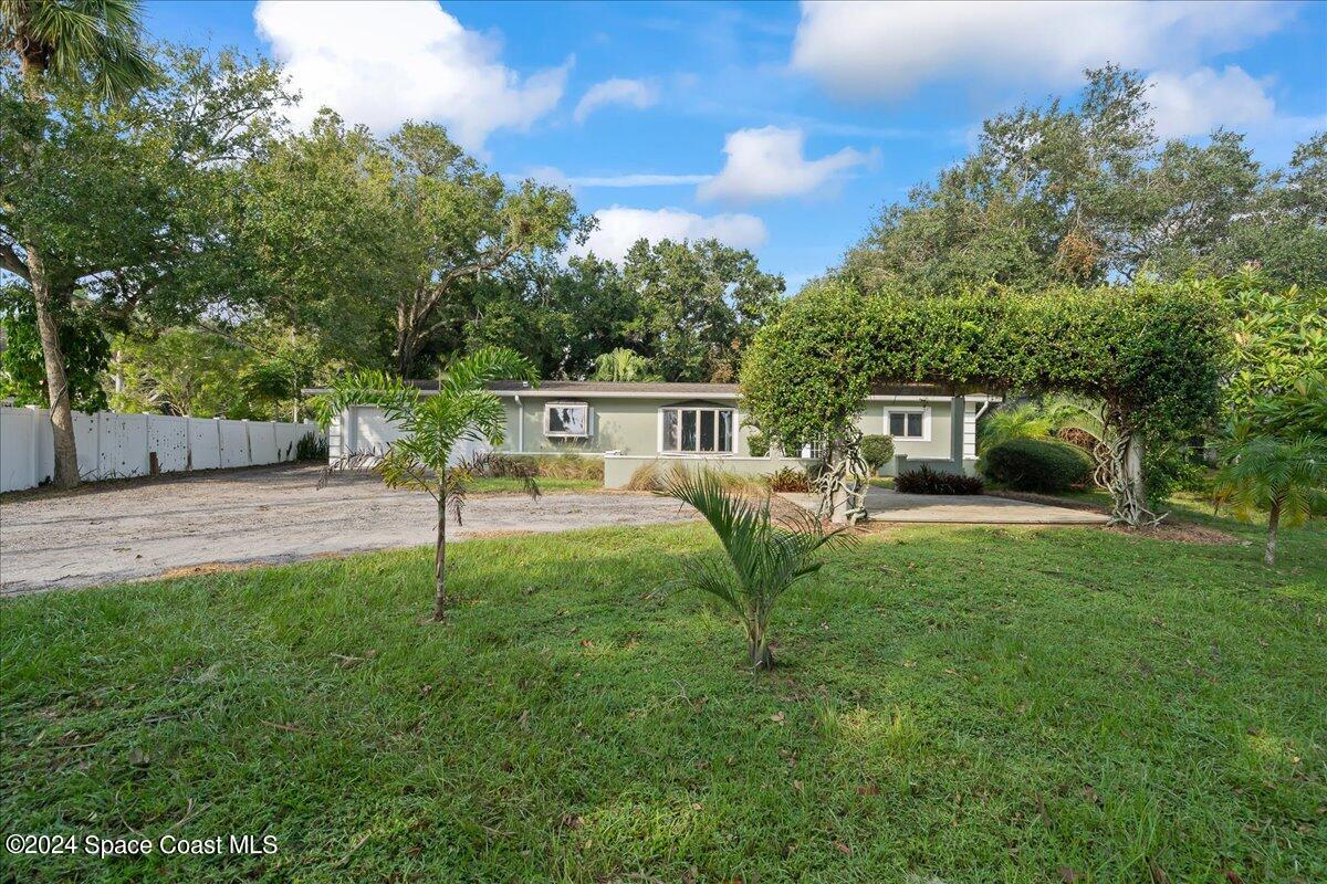 1469 Rockledge Drive Rockledge, FL 32955 - Photo 24 of 67 a view of a house with backyard and a slide