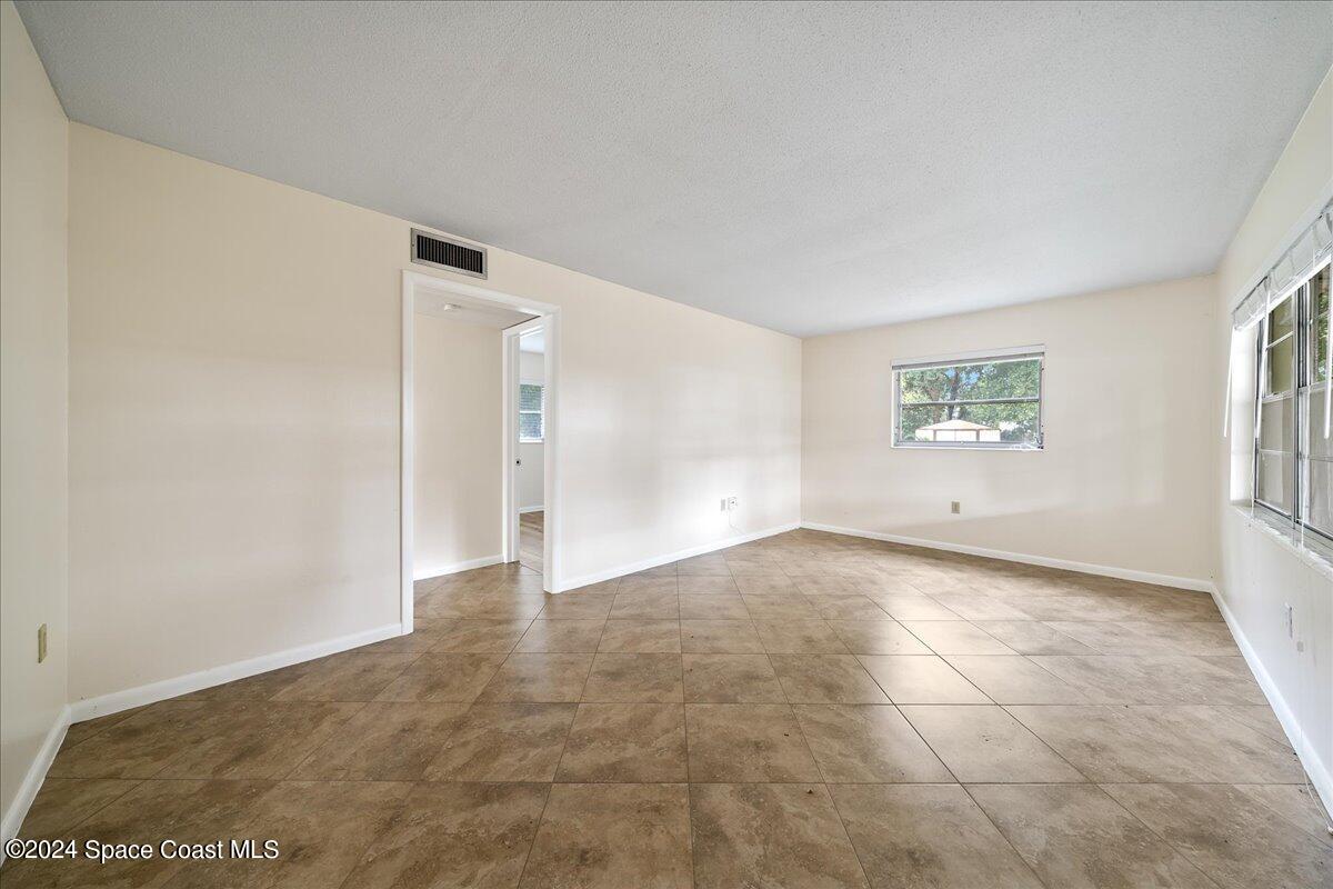 1469 Rockledge Drive Rockledge, FL 32955 - Photo 37 of 67 a view of an empty room with a window