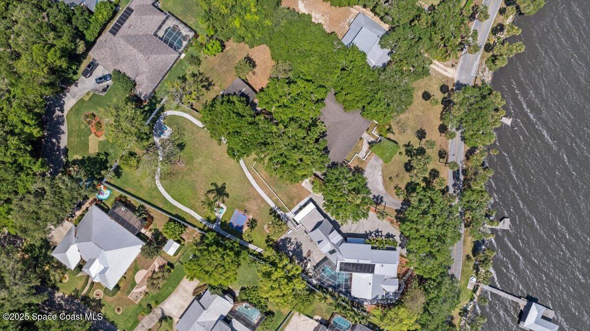1469 Rockledge Drive Rockledge, FL 32955 - Photo 49 of 67 an aerial view of a house with a yard