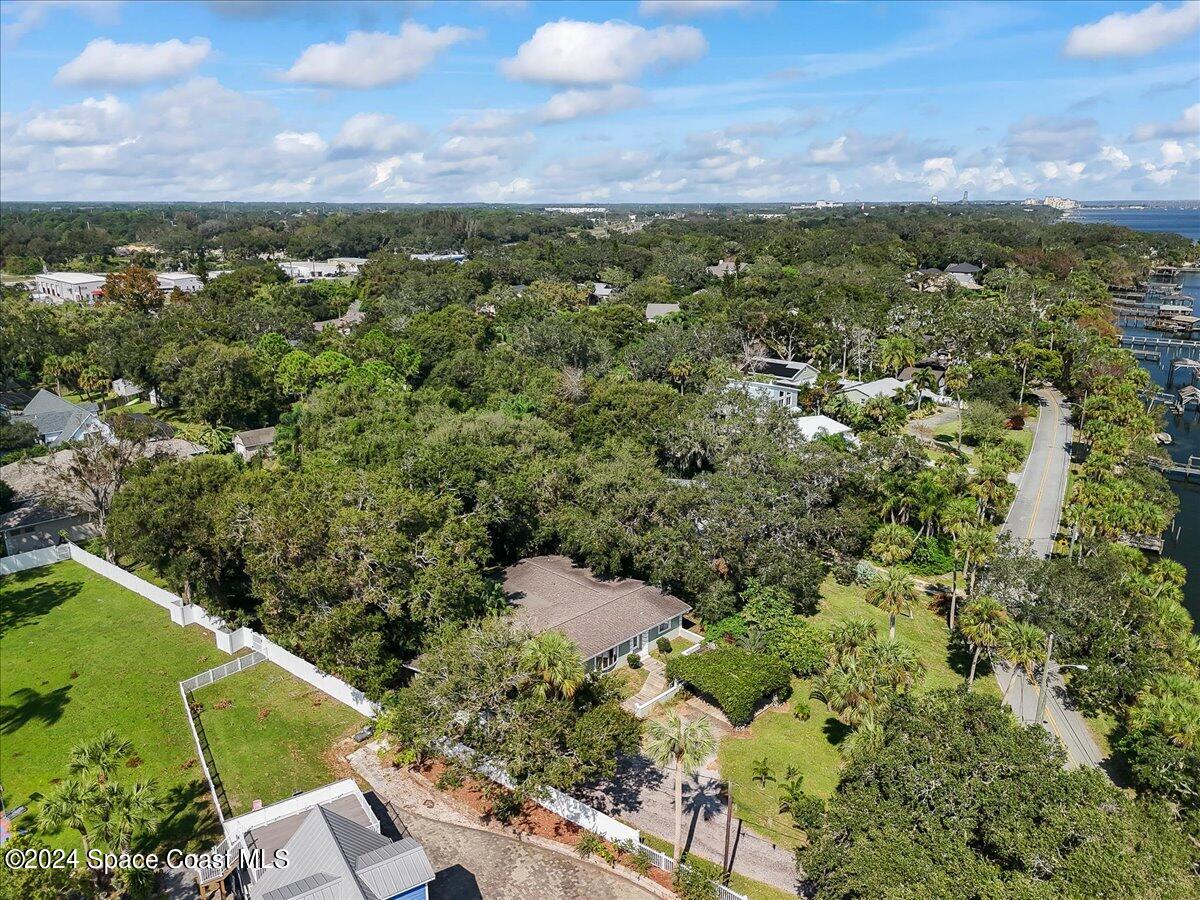 1469 Rockledge Drive Rockledge, FL 32955 - Photo 57 of 67 an aerial view of a house with a yard