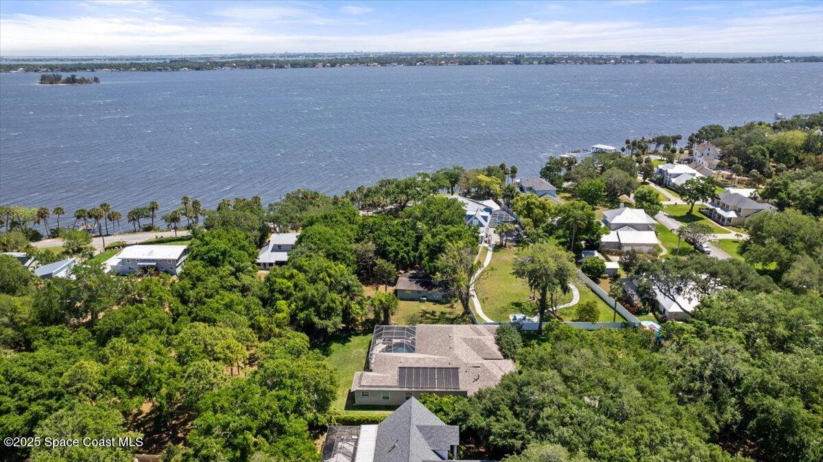 1469 Rockledge Drive Rockledge, FL 32955 - Photo 60 of 67 an aerial view of a house with a garden and lake view
