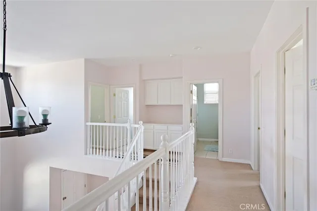 a view of a hallway with an entryway