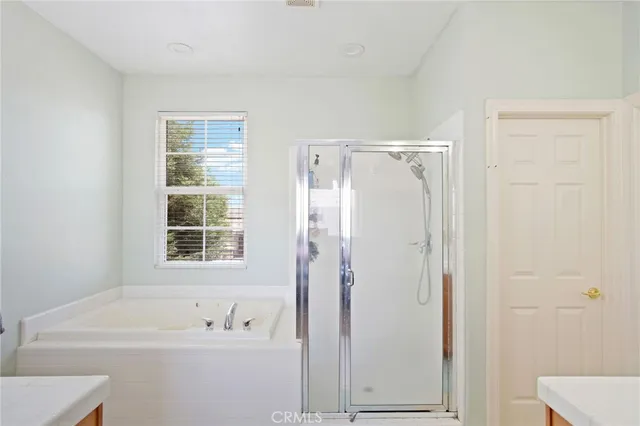 a view of a livingroom with furniture and a window
