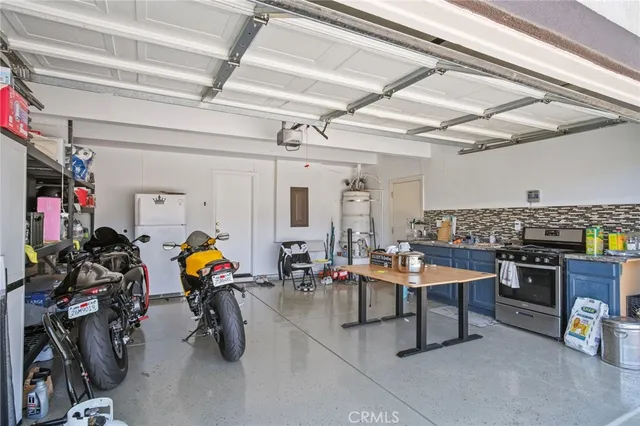 a view of a hallway with furniture and a window