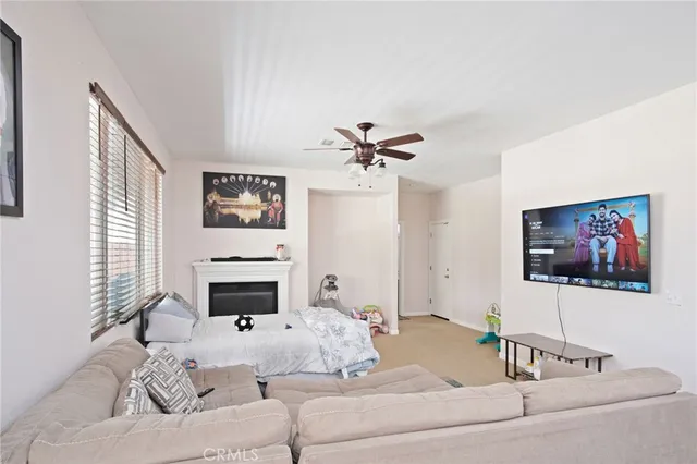 a living room with furniture fireplace and a flat screen tv