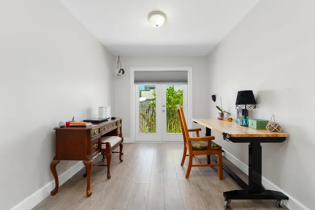 a workspace with furniture and a window