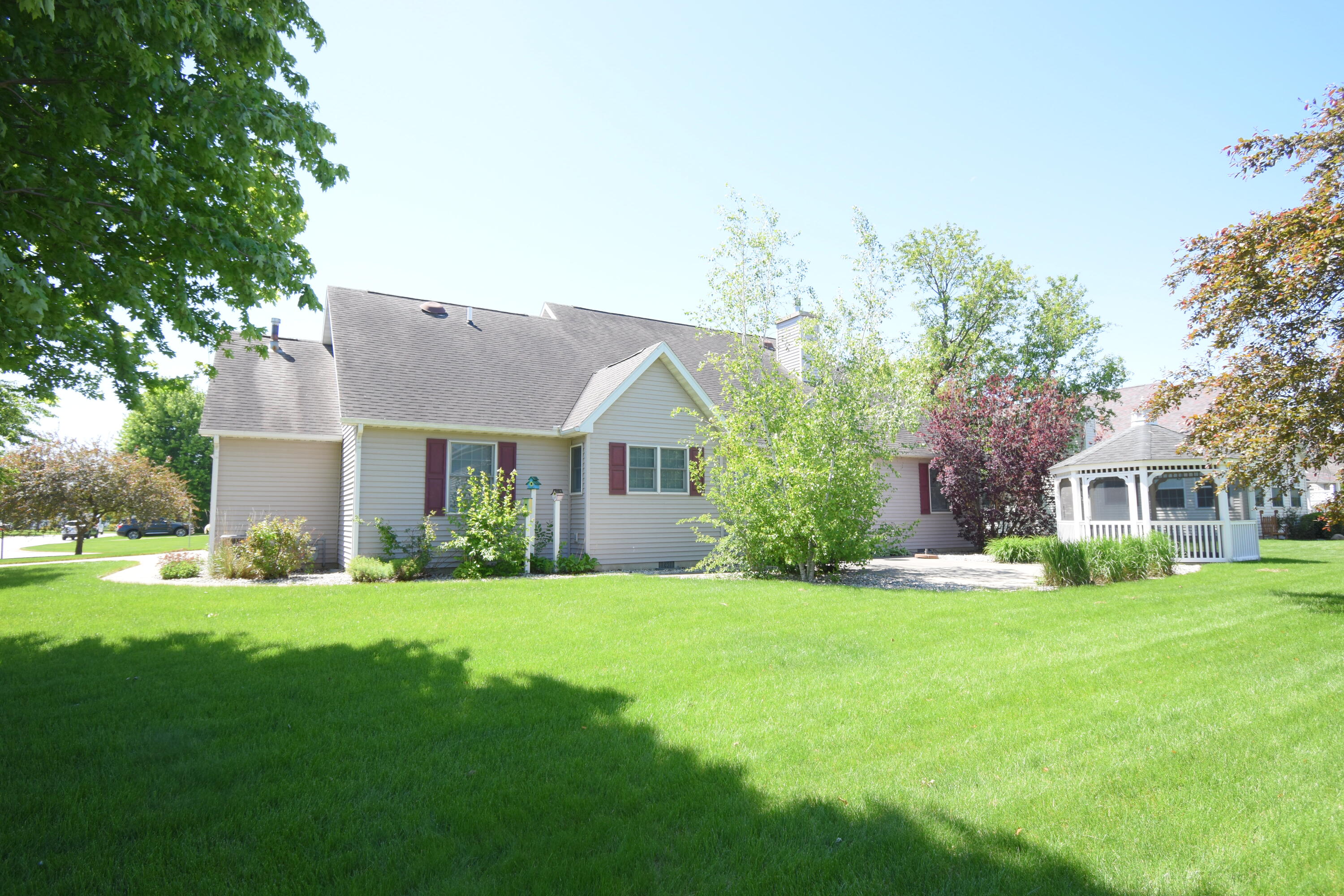 522 Pheasant Run Rensselaer, IN 47978 - Photo 10 of 55 a view of a house with a big yard and large trees
