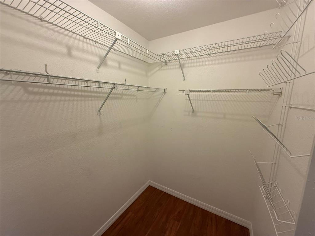 26186 Northern Cross Road, Unit 1B Punta Gorda, FL 33983 - Photo 14 of 22 a view of a room with racks on the wall