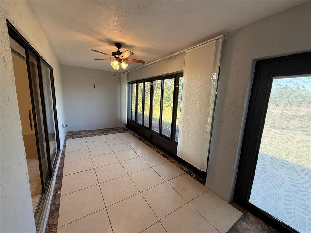 26186 Northern Cross Road, Unit 1B Punta Gorda, FL 33983 - Photo 19 of 22 a view of an empty room with a window