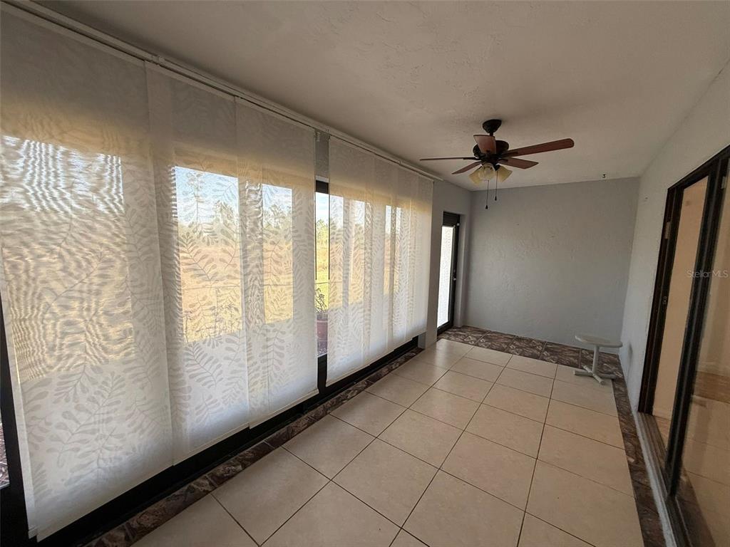 26186 Northern Cross Road, Unit 1B Punta Gorda, FL 33983 - Photo 21 of 22 a view of an empty room with a window