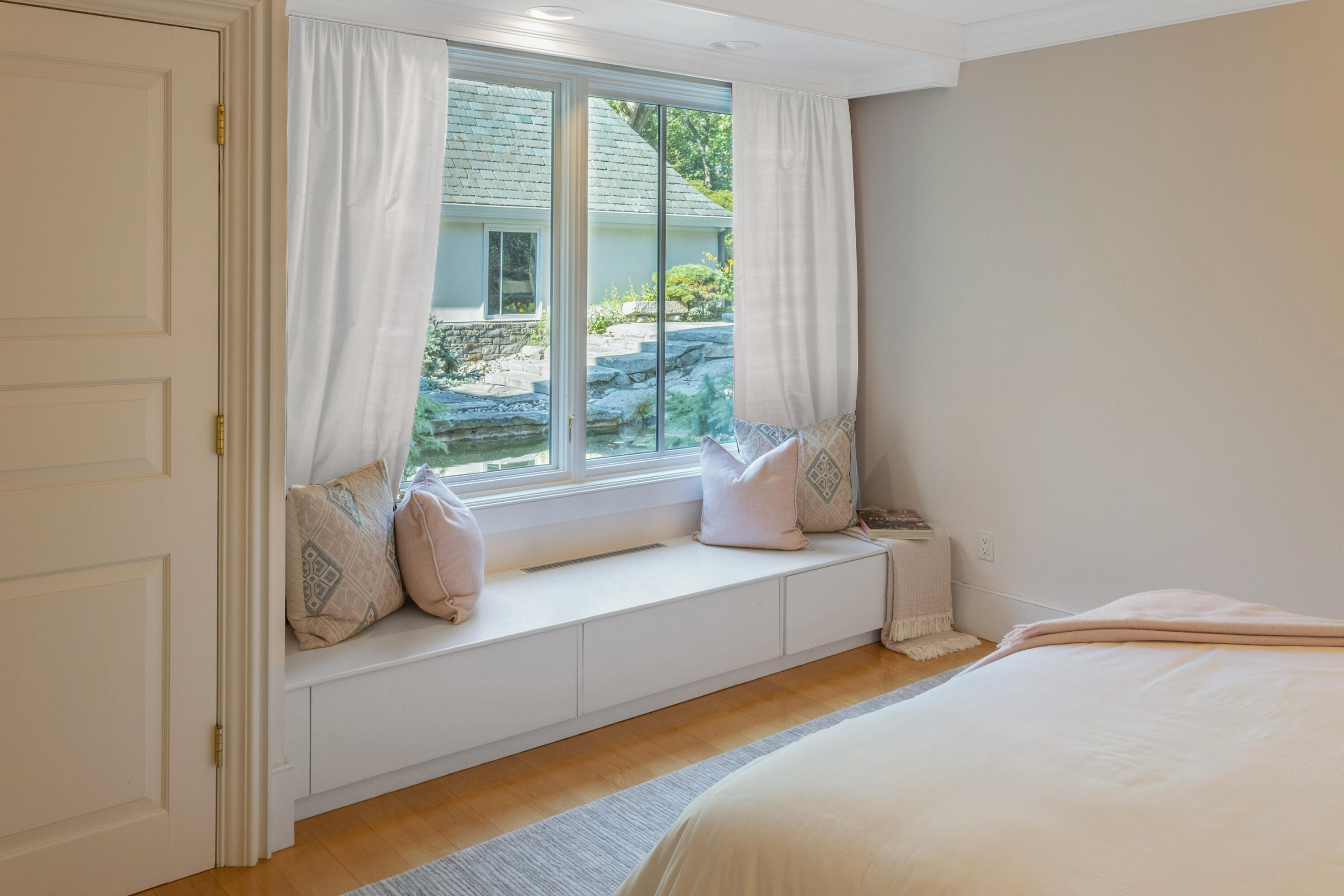 12 Butlers Island Road Darien, CT 06820 - Photo 27 of 39 a bedroom with a bed and large window