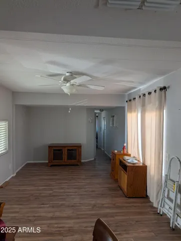 a view of kitchen and dining room with wooden floor