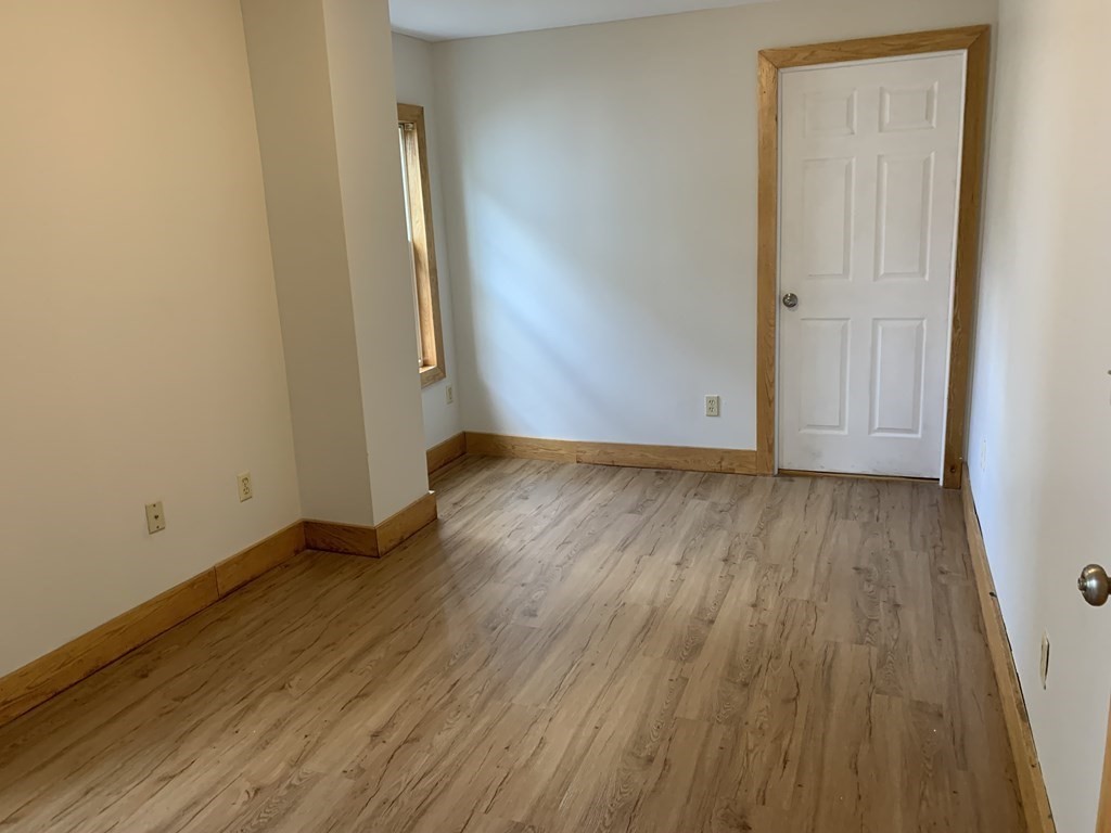 159 Chapman Street Greenfield, MA 01301 - Photo 12 of 36 an empty room with wooden floor and closet