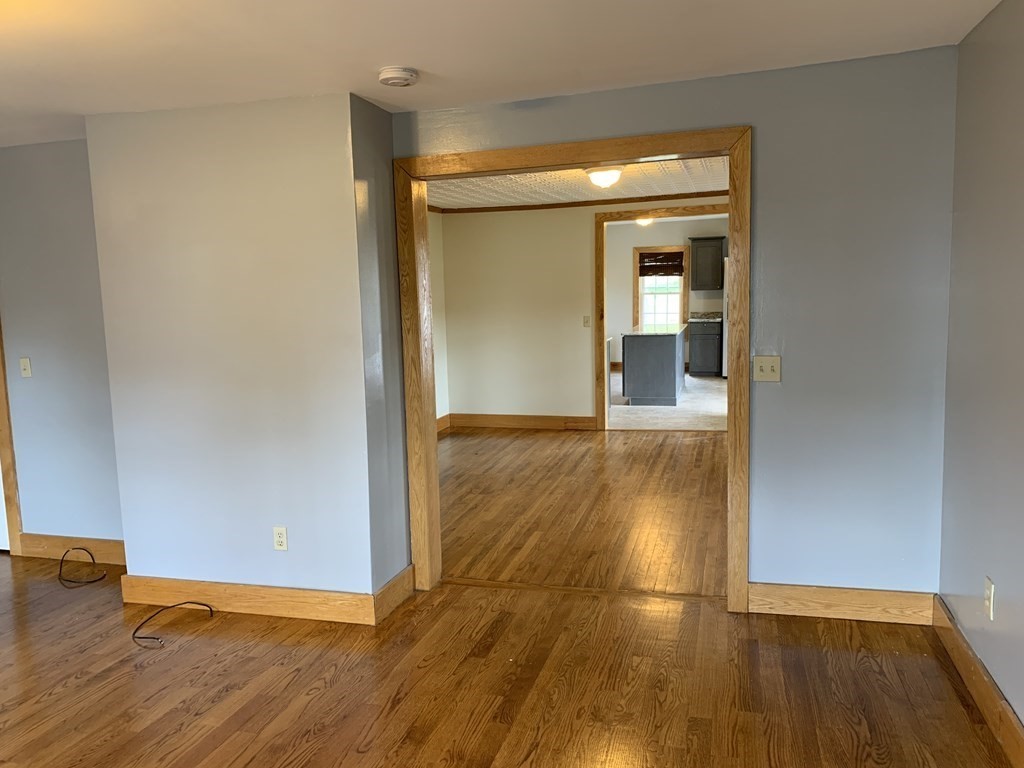 159 Chapman Street Greenfield, MA 01301 - Photo 14 of 36 a view of a room with wooden floor
