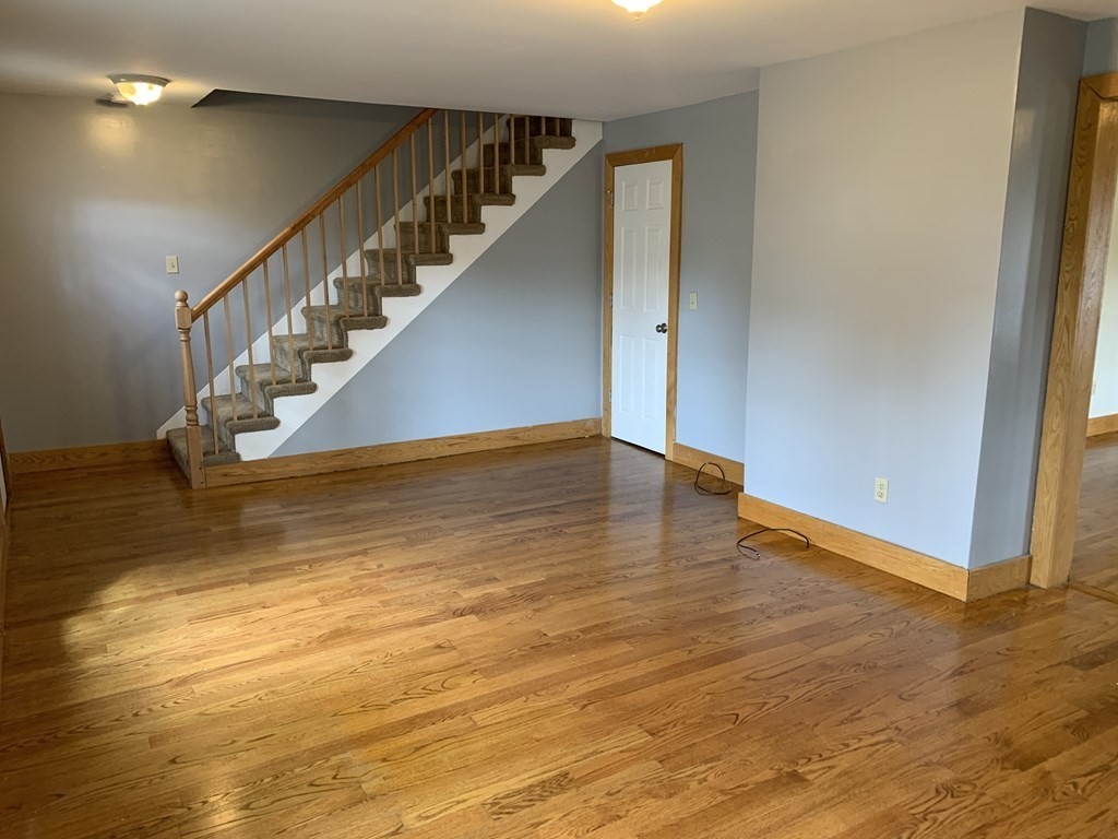 159 Chapman Street Greenfield, MA 01301 - Photo 15 of 36 a view of entryway and hall with wooden floor