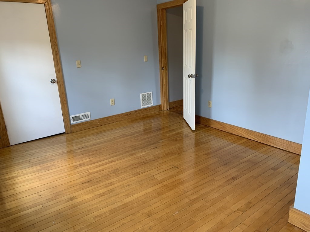 159 Chapman Street Greenfield, MA 01301 - Photo 21 of 36 a view of an empty room with wooden floor