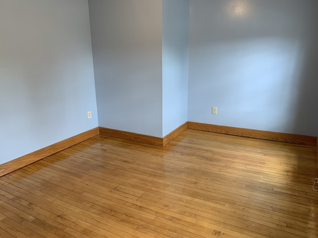 159 Chapman Street Greenfield, MA 01301 - Photo 22 of 36 a view of empty room with wooden floor