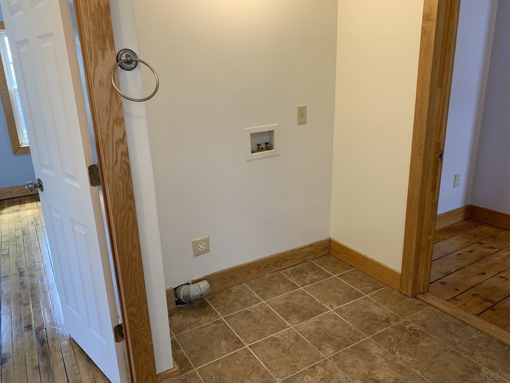 159 Chapman Street Greenfield, MA 01301 - Photo 25 of 36 a view of a room with rack on the wall and a window