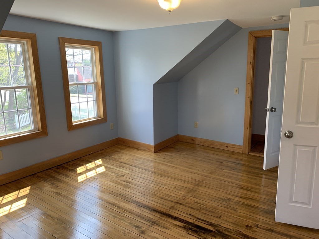 159 Chapman Street Greenfield, MA 01301 - Photo 29 of 36 a view of empty room with wooden floor and fan