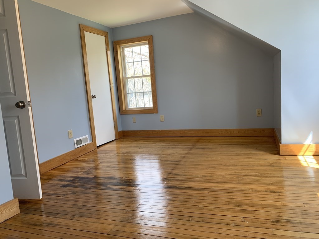 159 Chapman Street Greenfield, MA 01301 - Photo 30 of 36 wooden floor in an empty room with a window