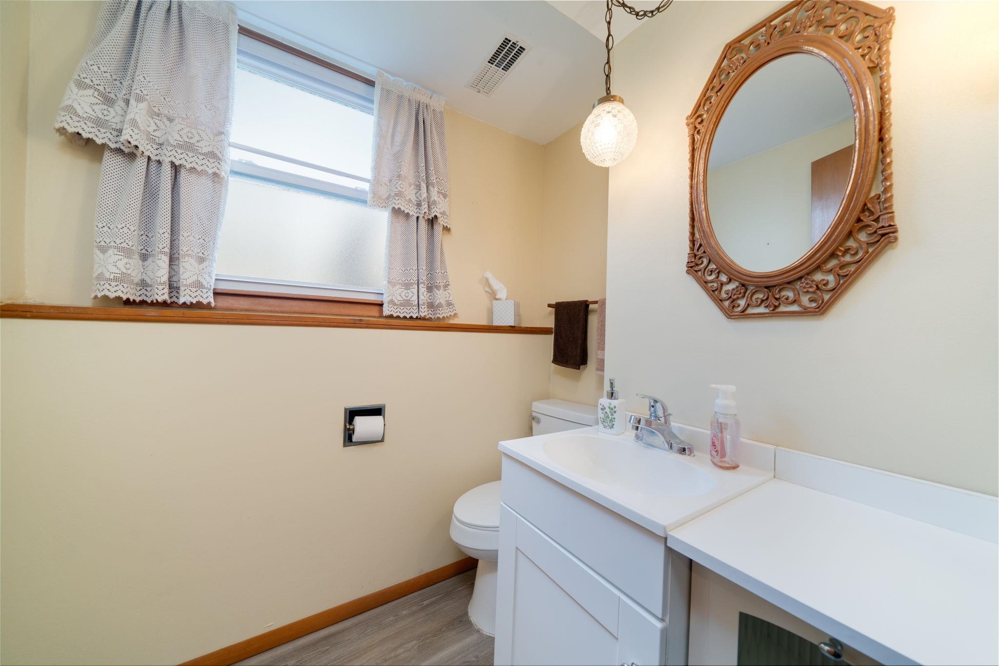 1611 Notre Dame Road Rockford, IL 61103 - Photo 19 of 33 a bathroom with a sink and a mirror