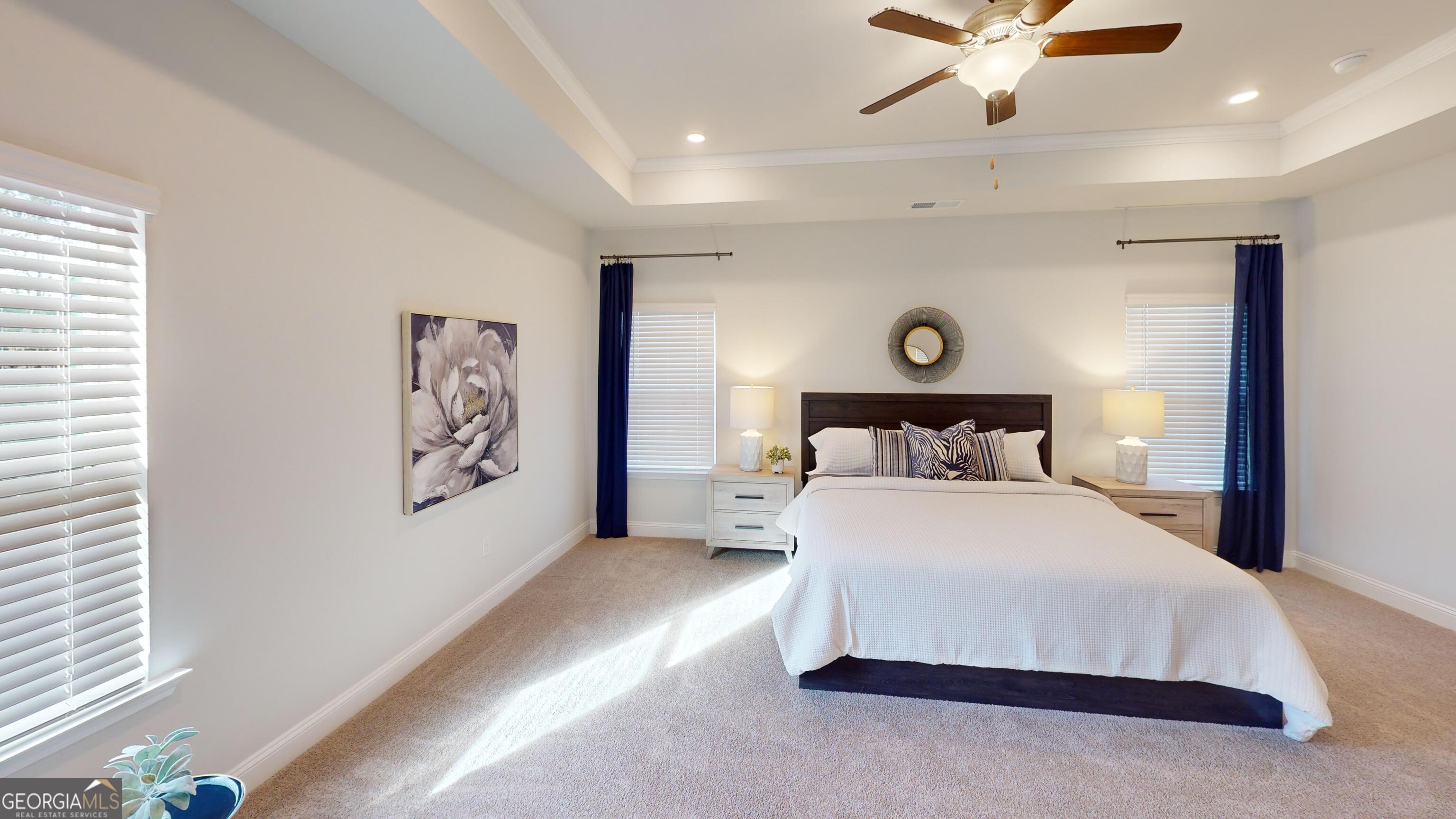 337 Stockton Circle Macon, GA 31216 - Photo 16 of 40 a spacious bedroom with a bed and a painting on the wall